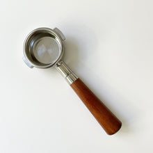 Load image into Gallery viewer, A bottomless portafilter with a 51mm size, featuring a two-ear design, almond-colored wooden handle, and stainless steel body.