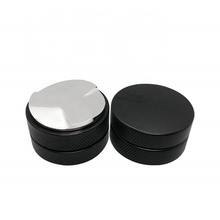Load image into Gallery viewer, Barista levelling a puck with 58mm distributor before tamping
